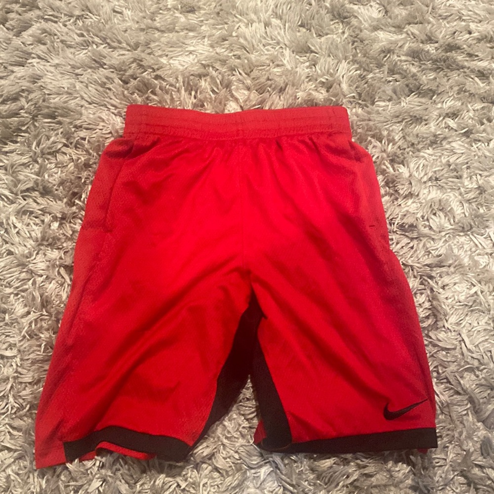 Red Nike shorts